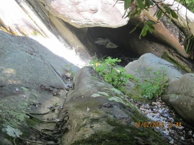 Water Cave
Steele Creek goes under this big rock, forming a foam whirlpool.

Views from this vantage point are the reason I give Steel reek Falls a *** rating. Note the rope on the rock. This is a very slick area so use the rope to hold on.

This little area can definitely clean your family gene pool.
