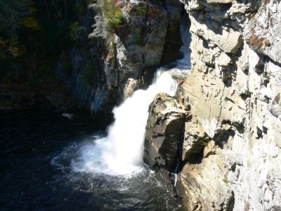 Turn Right And Plunge
After leaving the upper falls the river enters a narrow, short gorge, turns right and plunges into the lower gorge.

Is it a rough hike? Just plain fun all the way down and back up, maybe moderate. Left my walker on top.
