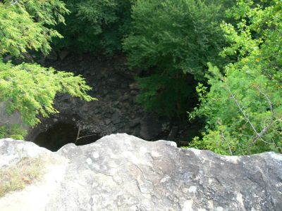 From the Ozone To The Abyss
Top of Ozone Falls looking down.

What this place needs is a good safety officer.
Actually, one can do this quiet safely by mounting a camera on a light weight tripod or monopod, delay the shot, focus and press the shutter button. Hold the camera out over the edge until it clicks.
