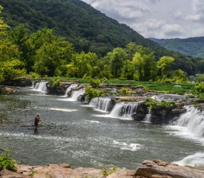 Fishing The New
 A fly fisherman just below Sandstone Falls. Talked with him later and he had csught some trout.
